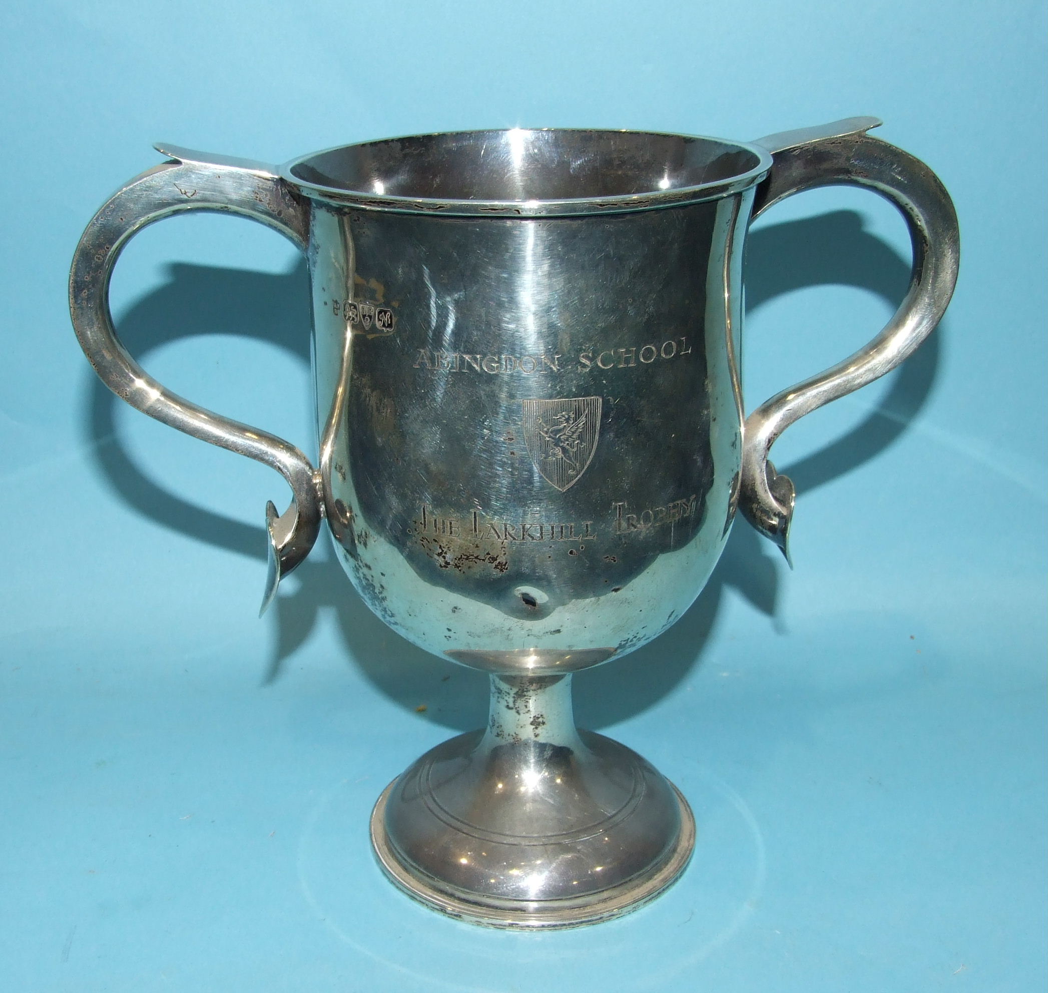 A George V silver presentation two-handled trophy cup on circular base, engraved Abingdon School,