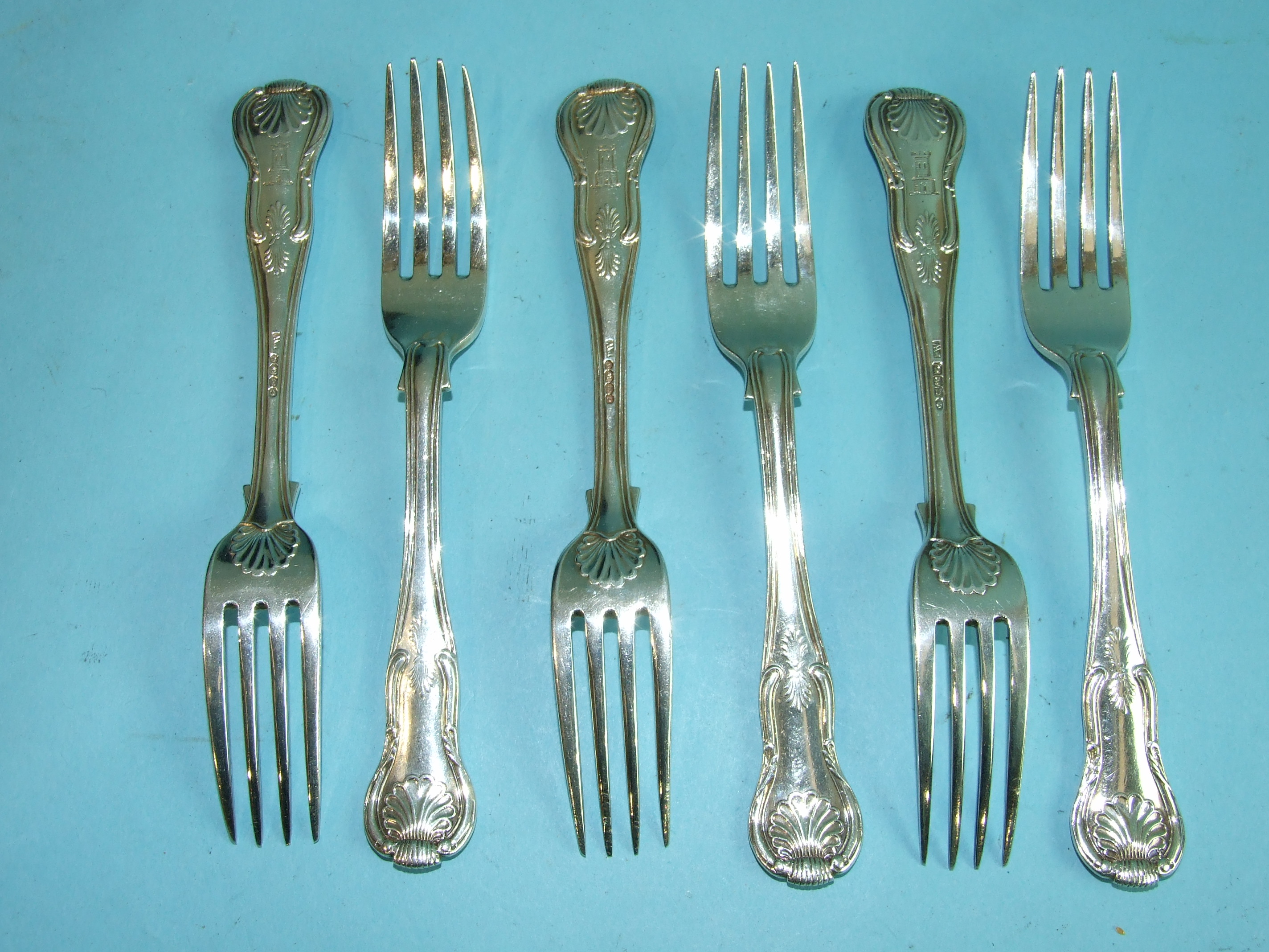 A set of six Irish king's pattern dessert forks, Dublin 1839, maker Philip Weekes, with castle