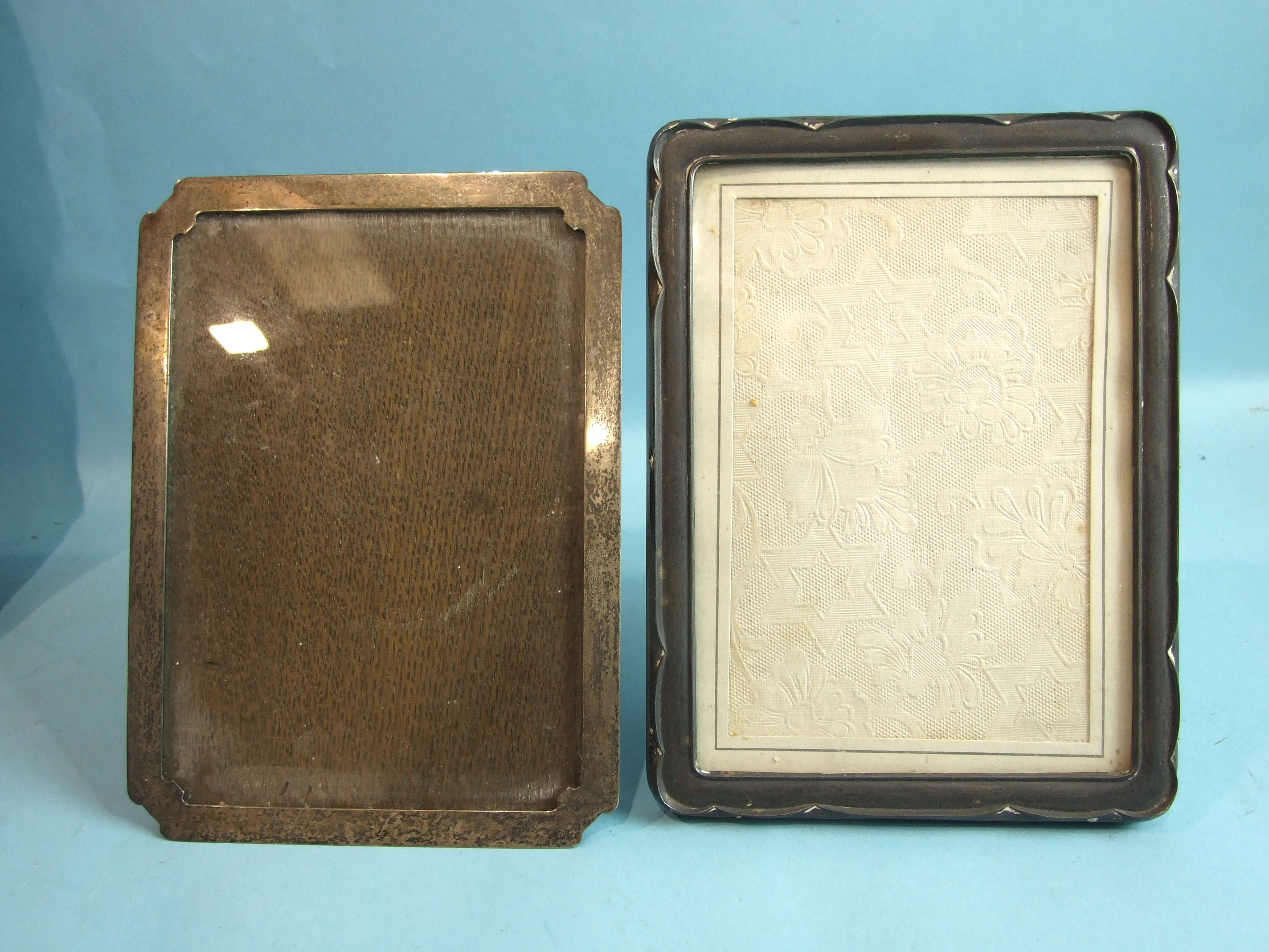 A rectangular photograph frame with clipped corners, 20 x 15cm, Birmingham 1925 and another, 21 x