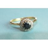 An 18ct gold sapphire and diamond cluster ring set a round-cut sapphire and ten 8/8-cut diamonds,