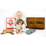 Shirley Temple doll, another doll, vintage Monopoly, tin plate car and a Table Tennis set.This lot