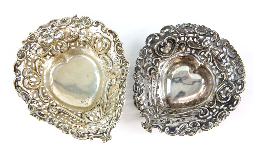 Two heart shaped silver dishes