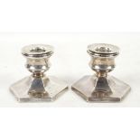 Pair of silver dwarf candlesticks, each on hexagonal filled bases (2)