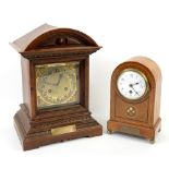 Early 20th century walnut twin train mantel clock, and anotherThis lot is being sold on behalf of