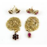Ruby and diamond cluster pendant and earring set, and a similar garnet pendant and stud set, all