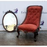 Red upholstered Victorian nursing chair and a mirror