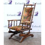 Late 19th/early 20th walnut and upholstered rocking chair with turned back, arms and supports,