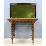 Early 20th century mahogany fold over card table on turned supports,