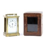 Brass and glass carriage clock in leather case