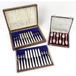 Cased set of silver and mother-of-pearl dessert knives and forks, with a cased set of silver
