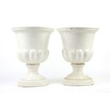 Pair of porcelain urns, wicker picnic case, breakfast tray and dumb waiter