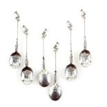 Set of six 19th Century continental silver spoons with stems formed with a woman figure and twist