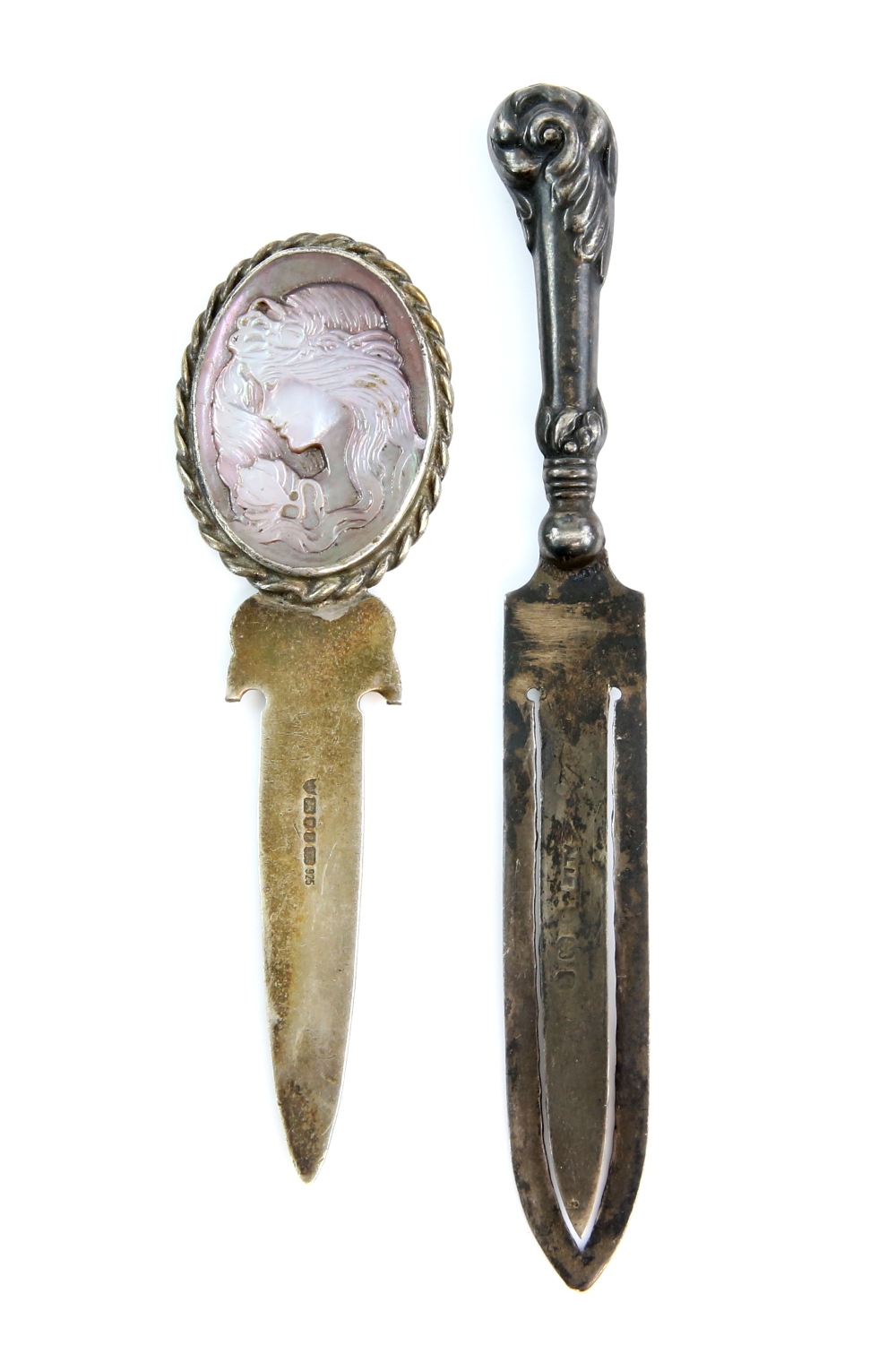 Two silver bookmarks, one with carved handle other with scrolled handle