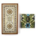 A William de Morgan Persian pattern tile, impressed marks to reverse, 15.5 x 16 cm and two Minton