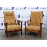 Two oak Arts & Crafts reclining armchairs, with pierced slats and turned legs, upholstered in