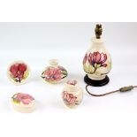 Group of Moorcroft pottery decorated in the 'Pink Magnolia' pattern on an ivory ground, comprising a