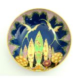 Carlton ware dish painted in enamels with gilt highlights, depicting two birds of paradise above a