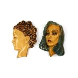Two Art Deco plaster face mask wall plaques, largest 28cm. (2).