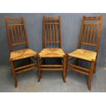 Set of six Arts & Crafts oak chairs with shaped carved splat backs and pierced back rail, sea