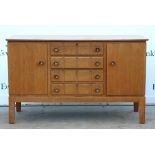 Gordon Russell light oak dining room suite comprising of a sideboard with two cupboards and four