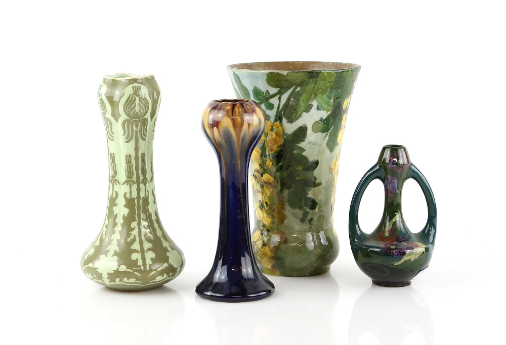 Four Art Pottery vases, a Gouda twin handled vase, another with Art Nouveau decoration, a