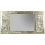 Glasgow School, an Arts & Crafts brass mirror, with hammered panels, tree of life design, 47 x 92