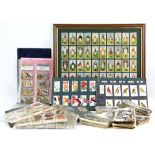 Three albums of cigarette cards, loose cards, silks, postcards and photographs