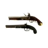 Percussion cap pistol with 23cm barrel and chequered walnut stock, and sliding safety catch, the
