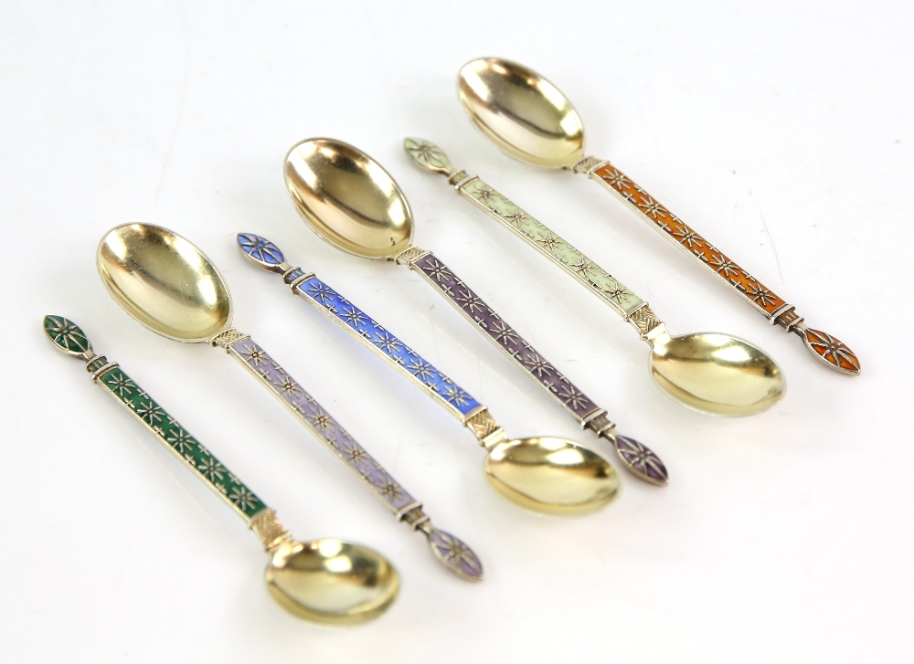 Set of six continental silver 830 grade enamel spoons with star design both front and back with gilt