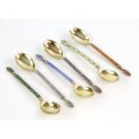 Set of six continental silver 830 grade enamel spoons with star design both front and back with gilt