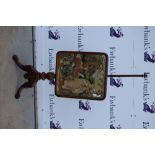 19th century mahogany pole screen with tapestry decoration on scrolling tripod base,.