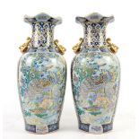 A pair of modern chinese vases in blue and gilt.