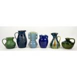 Group of Art pottery including a green Compton pottery jug, another by Govancroft Glasgow and four