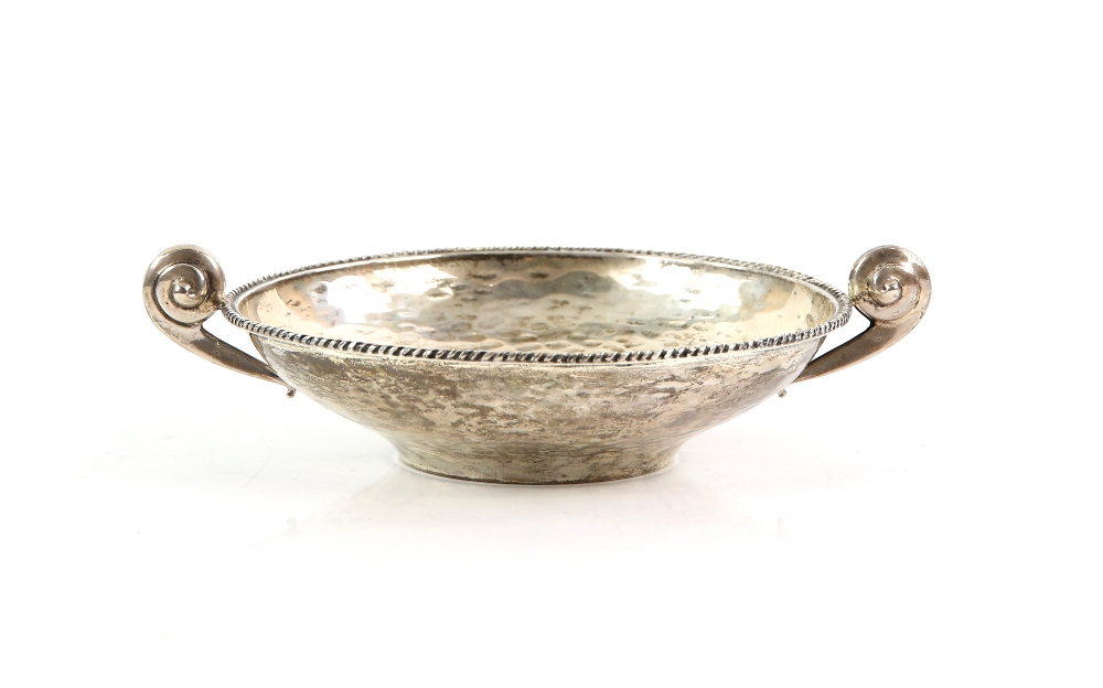 Silver bowl with hammered finish, 158 grams with swirl turned handle .