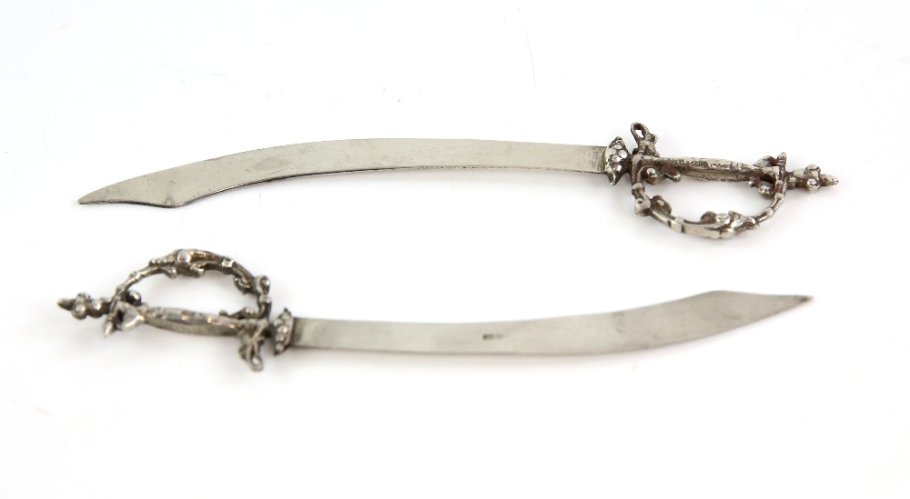 Novelty pair of Egyptian silver sword form letter openers.