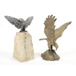 WMF stamped silver plated eagle on stone pedestal and similar one in brass..