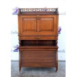 Ladies mahogany bureau, pierced backrail, the drop flap revealing pigeonhole interior, tambour base.