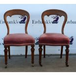 Set of four 19th century oak balloon back dining chairs .