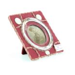 Silver mounted photograph frame, with mother-of-pearl decoration.