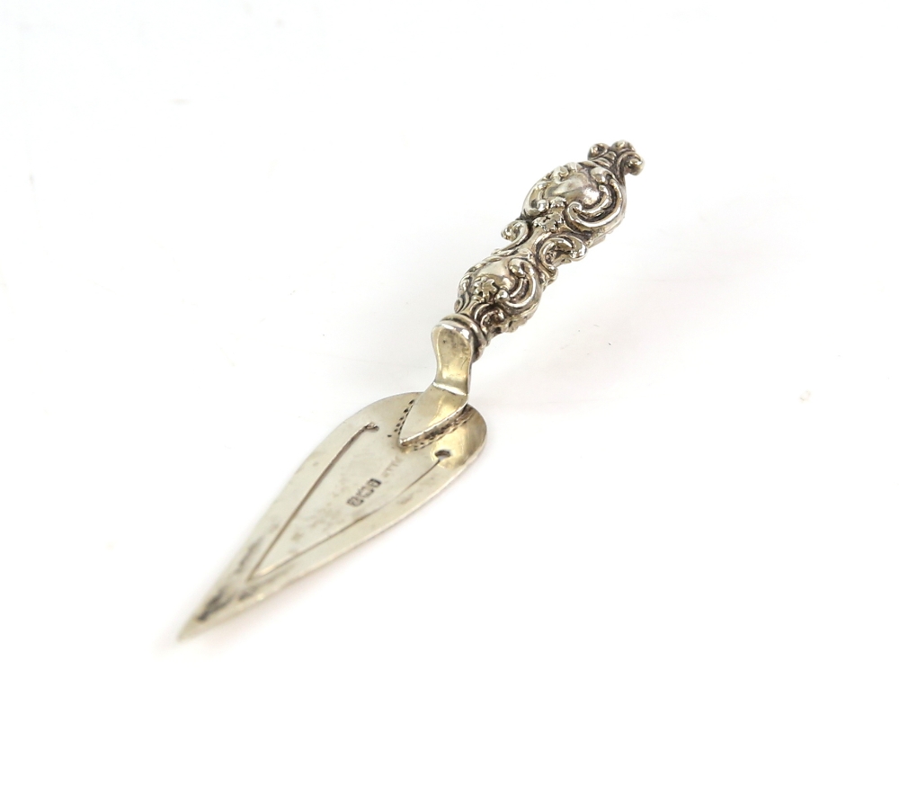 Silver bookmark in the form of a trowel with scrolled handle, Birmingham 1899.