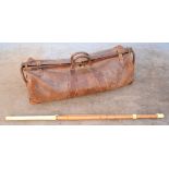 Vintage leather cricket bag and a Kendo stick.
