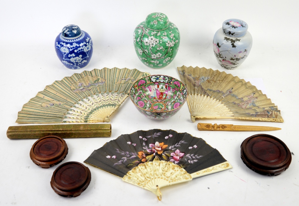 Collection of fans, ginger jars, three hardwood stands and a Cantonese bowl .