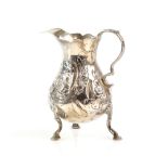 Georgian silver cream jug London, 1756. Marks rubbed. Feet pushed in. Decoration worn. Bad repair to