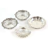 Pair of pierced silver dishes, Birmingham 1910 and two other silver dishes.