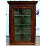 19th century mahogany corner cabinet with glazed door .