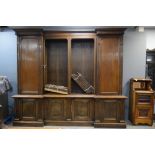 19th century walnut inverted breakfront bookcase with open section flanked by cupboards over further