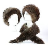 A black fur hat with ear muffs, 3 other brown fur hats ,Two brown fur jackets and a Tescan fur