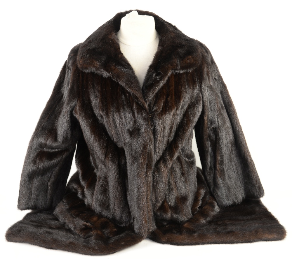 A mink full length coat and a fur wrap.