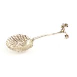 Edwardian import silver caddy spoon with shell and organic bowl and cherub finial to handle,