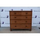 Oak chest of drawers with two short over three long drawers.